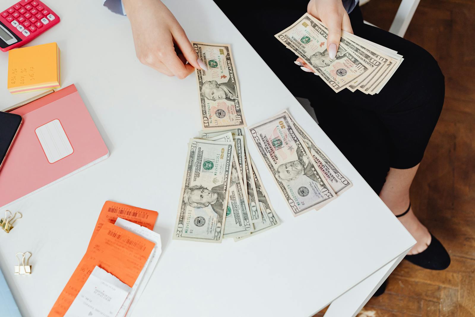 hands counting receipts