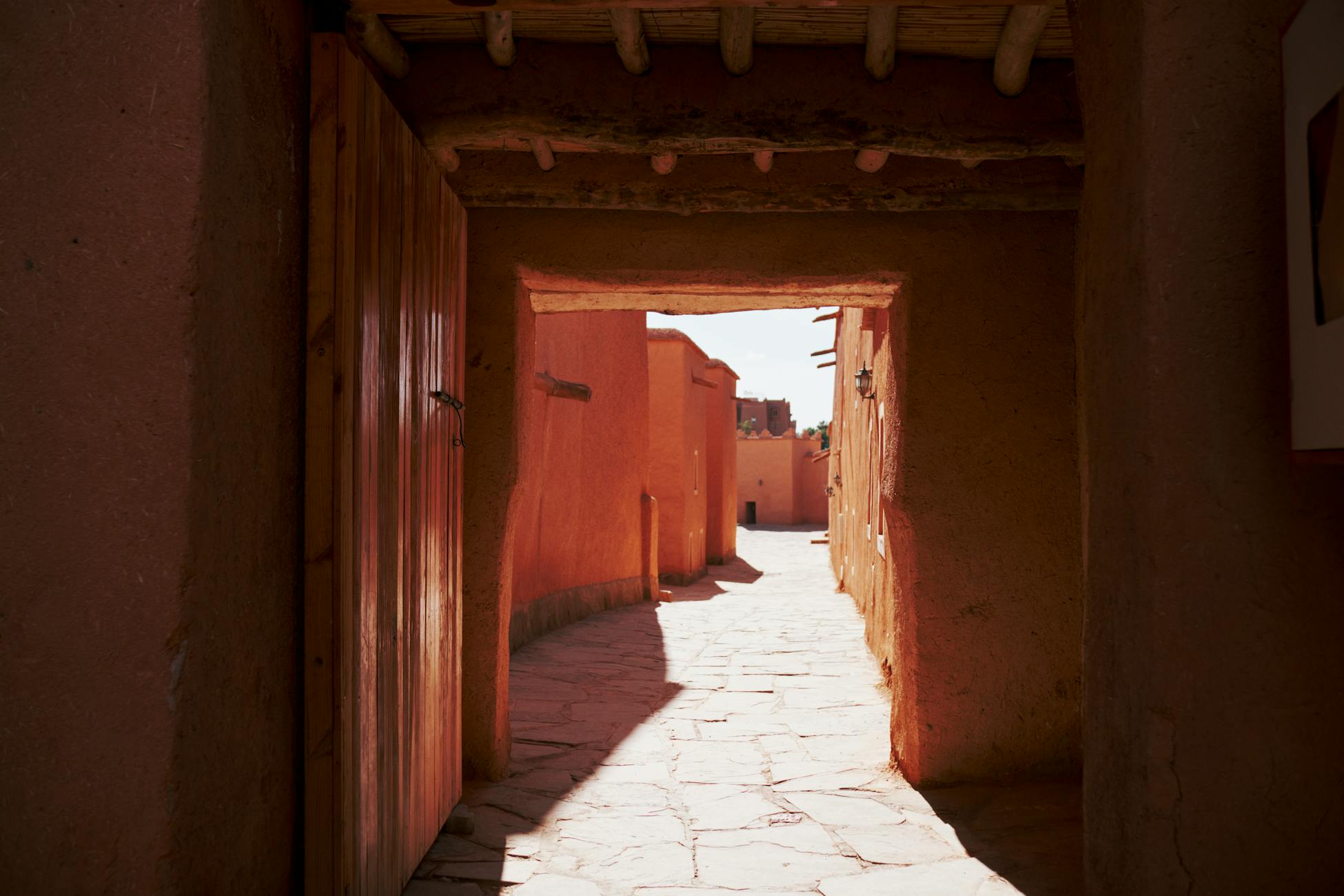 Captivating warm-toned alleyway in Morocco, showcasing traditional architecture under daylight.