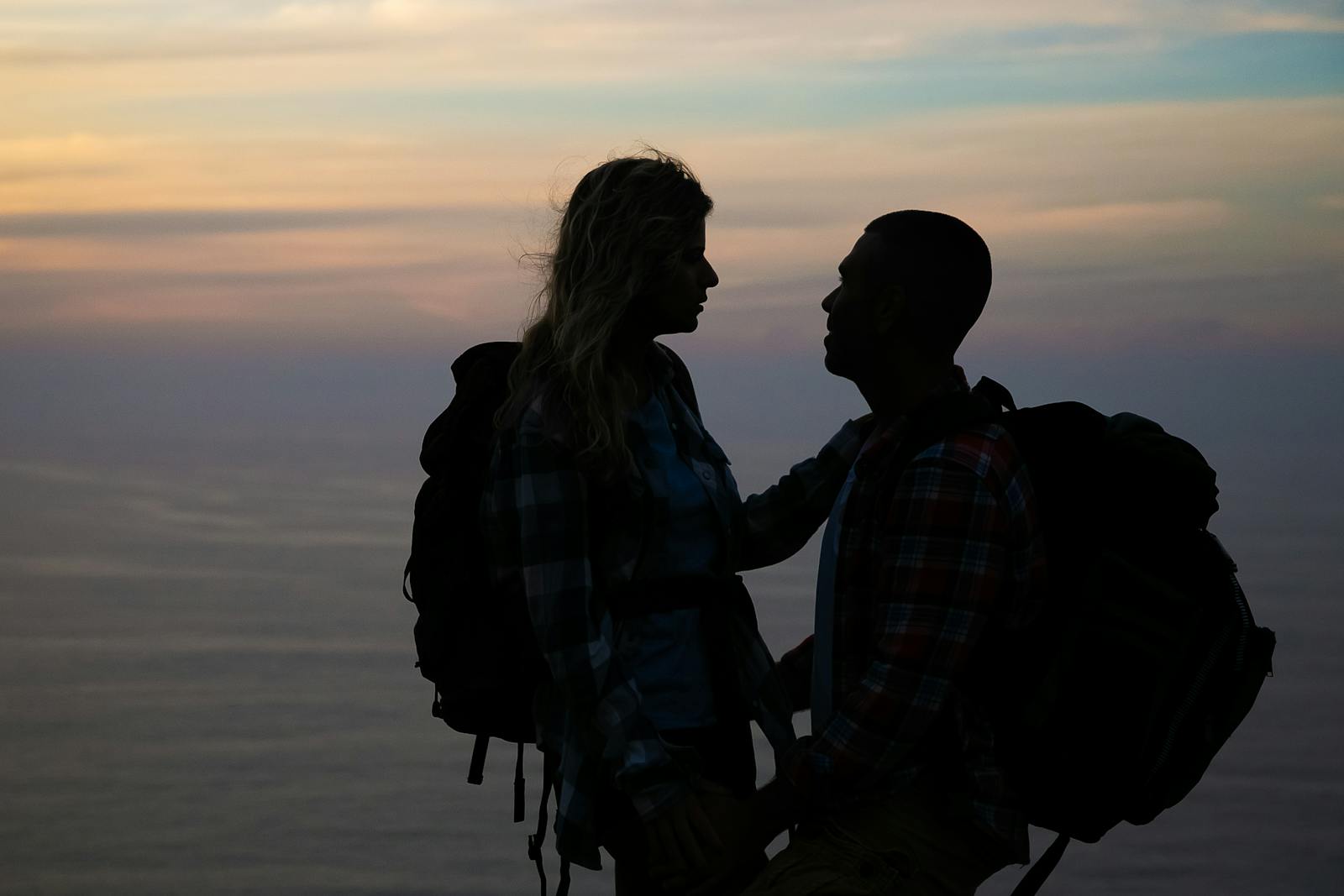 two silhouettes facing each other