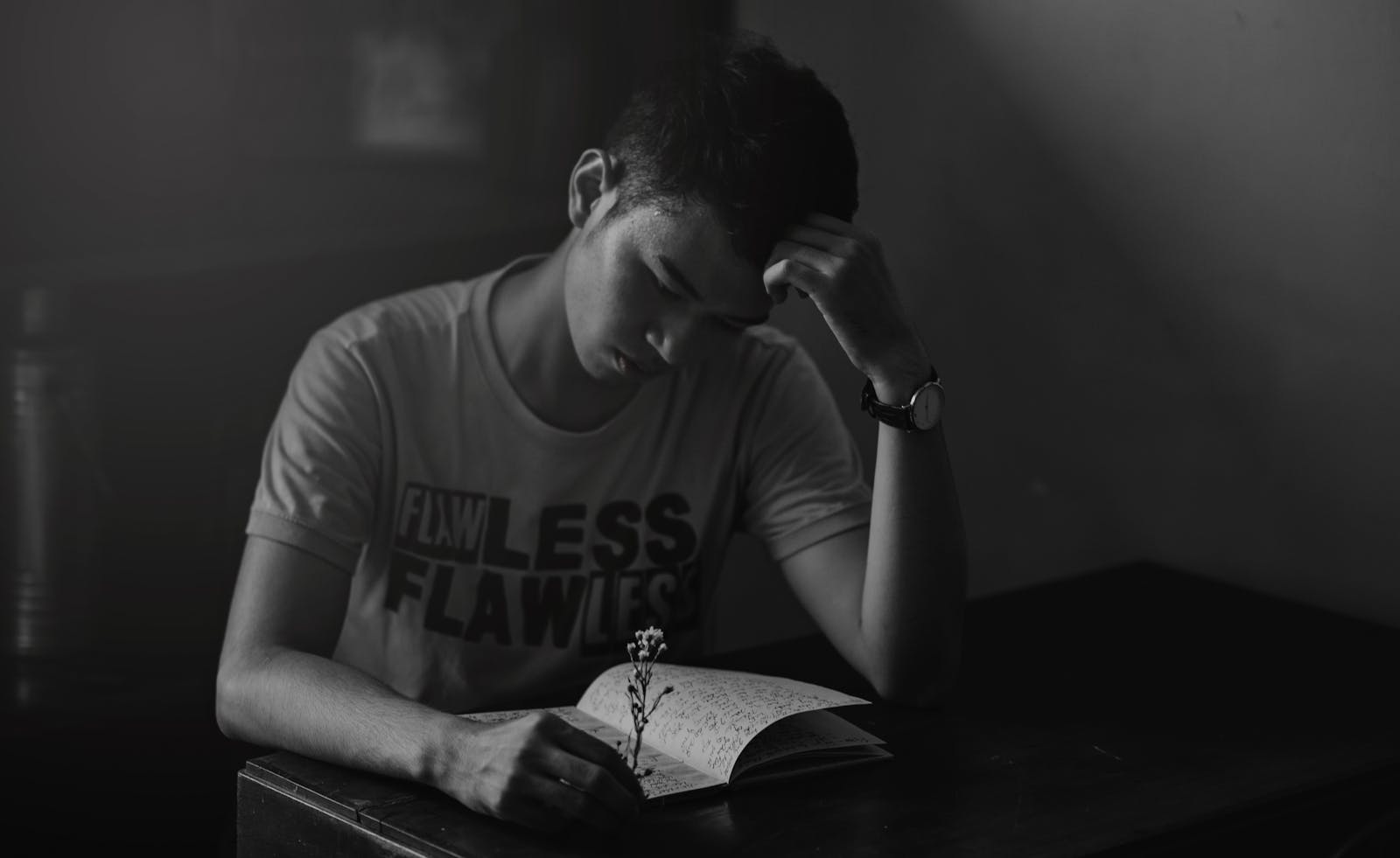 man journaling alone