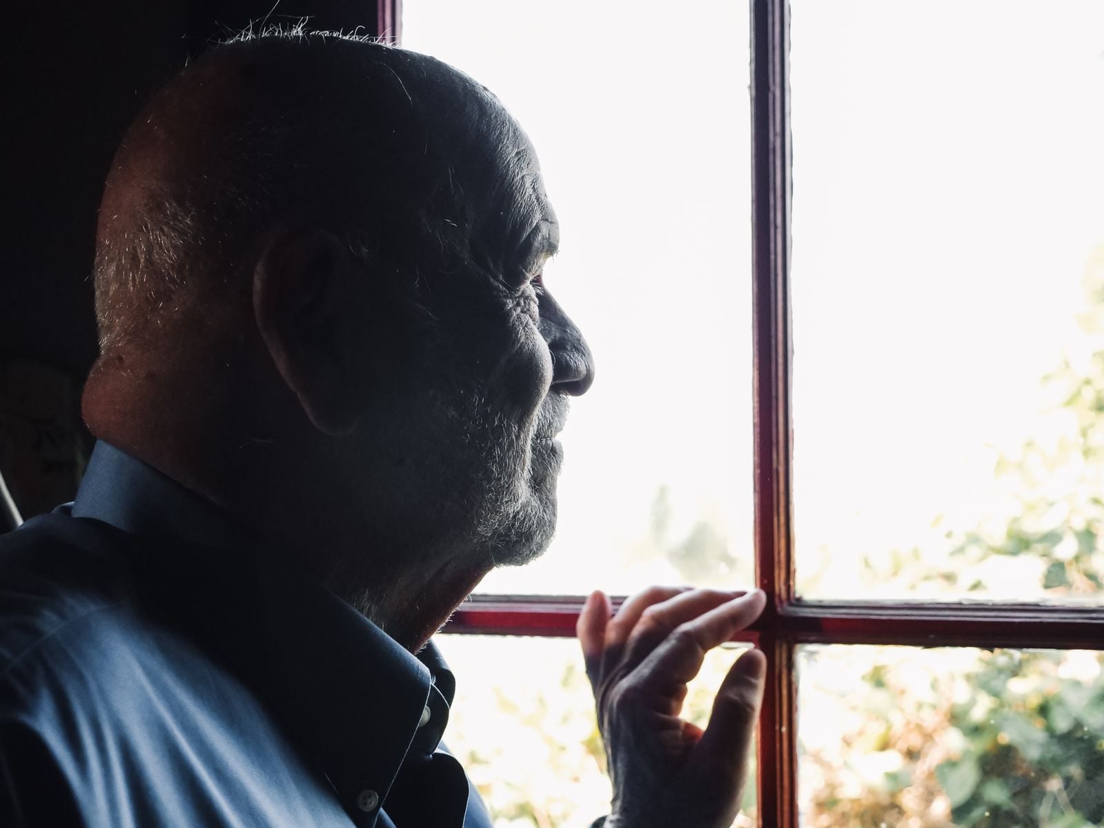 older man window morning