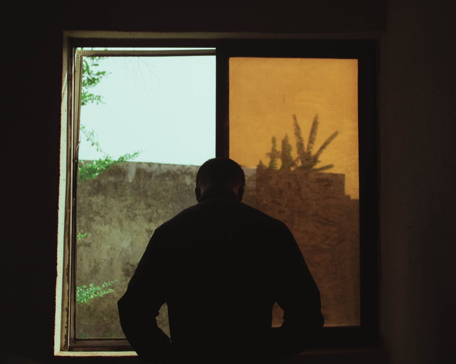elderly couple silhouette window