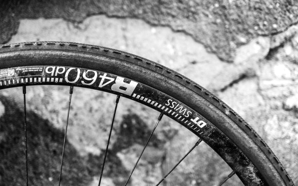 In 1888, a Scottish veterinarian named John Boyd Dunlop watched his son bounce painfully along a cobbled path on a tricycle and glued strips of rubber into a tube of air around the wheels that night, because the boy had complained of headaches from the ride — and the pneumatic tyre he improvised in his garden was working on Belfast streets within a year