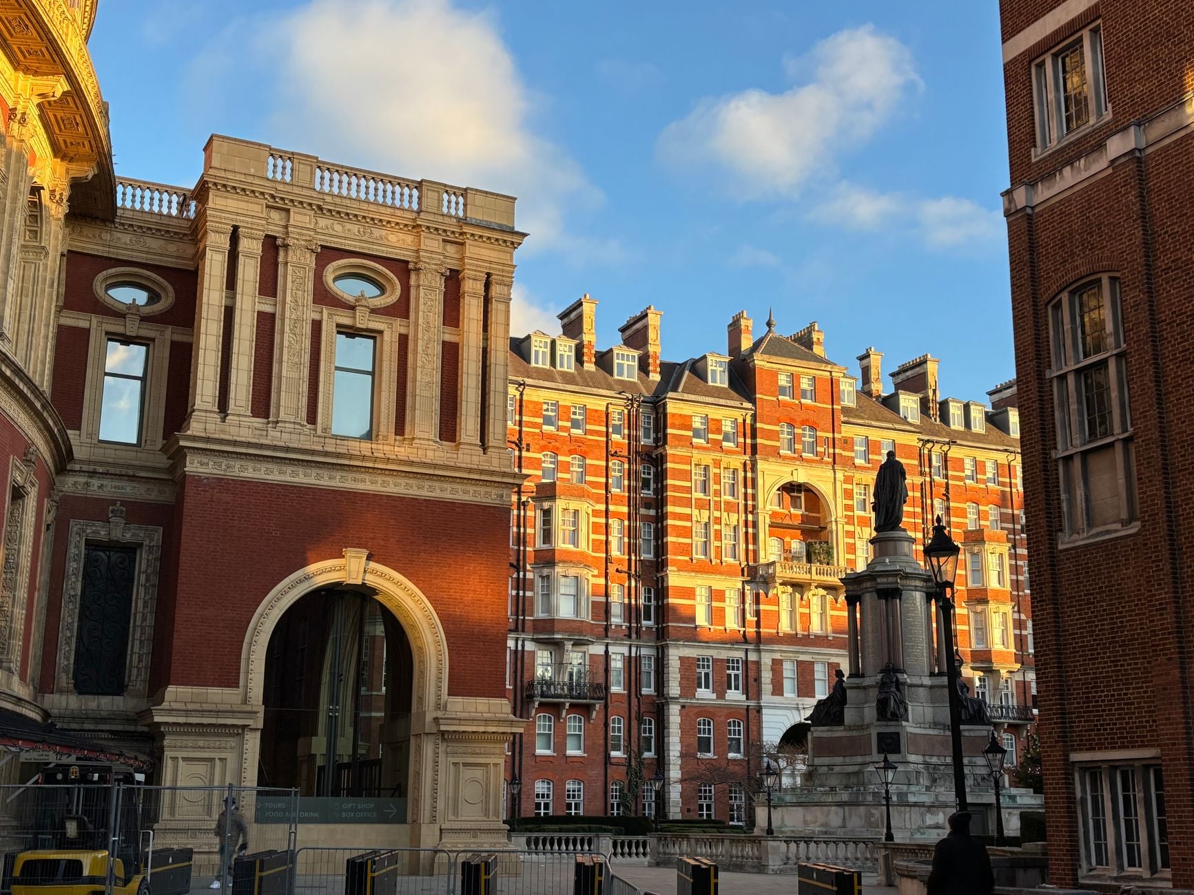 Captivating view of London architecture with sunlight and blue skies, highlighting historic facades.