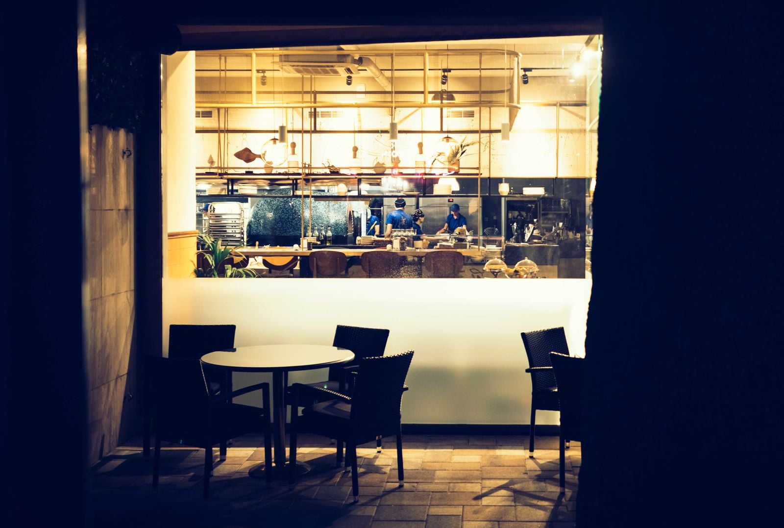 lit kitchen window night