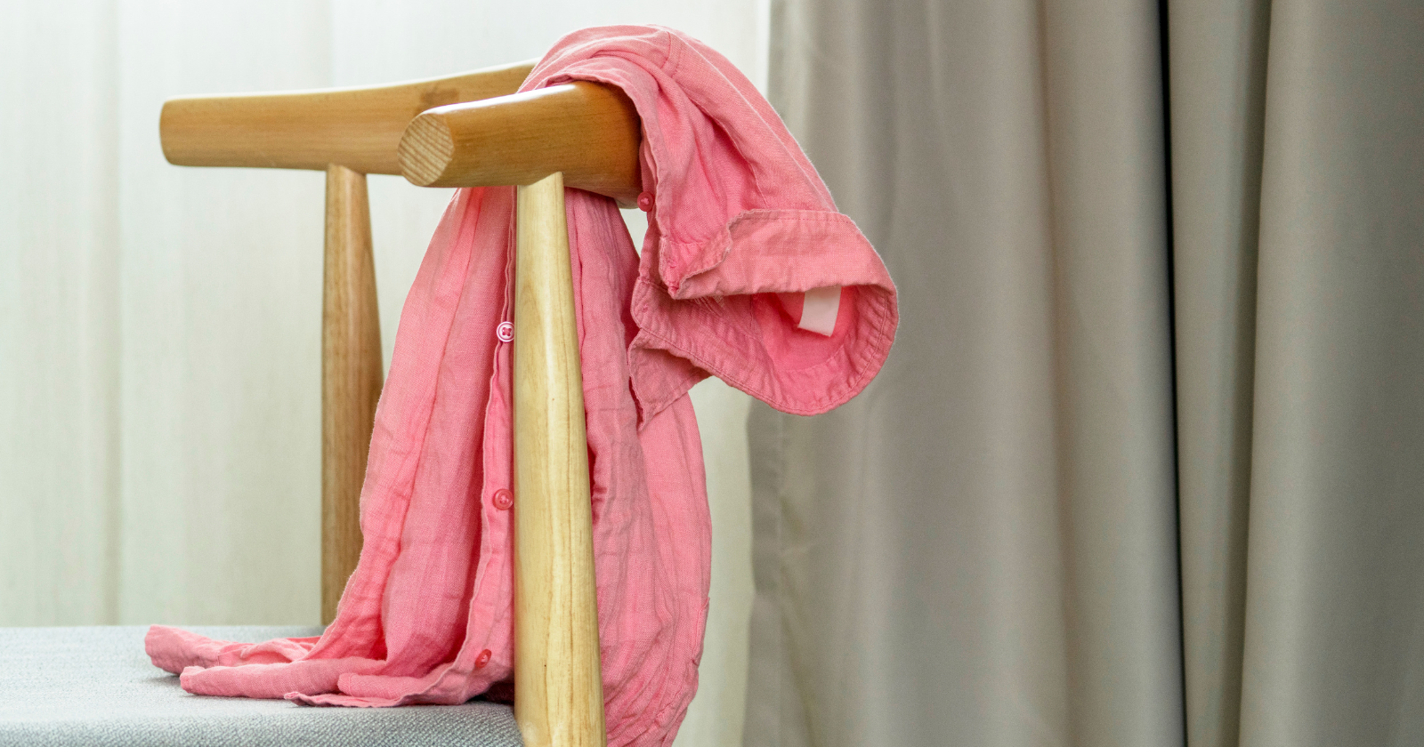 People who keep a chair in the bedroom that always has clothes on it aren't necessarily messy, they're navigating the small daily gap between clothes clean enough to reuse and clothes ready to be put away, a category most household systems still ignore