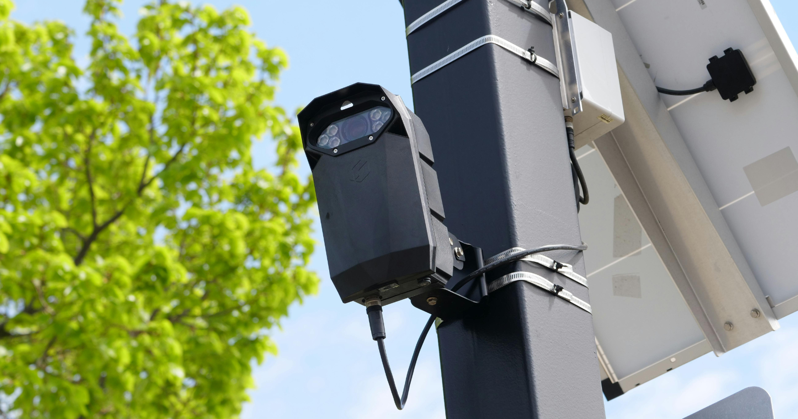 Twelve microphone-equipped cameras on New York streets logged 15,994 loud-vehicle events in 2025 and produced 1,691 summonses carrying $1,472,265 in penalties, of which $308,229 was actually paid, and thirteen of the twenty-five cameras the city's own law requires were never bought.